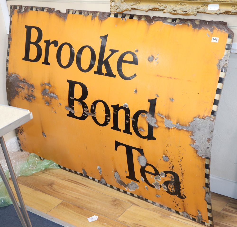 A Brooke Bond Tea enamelled sign and Two Steeples Pure Underwear,